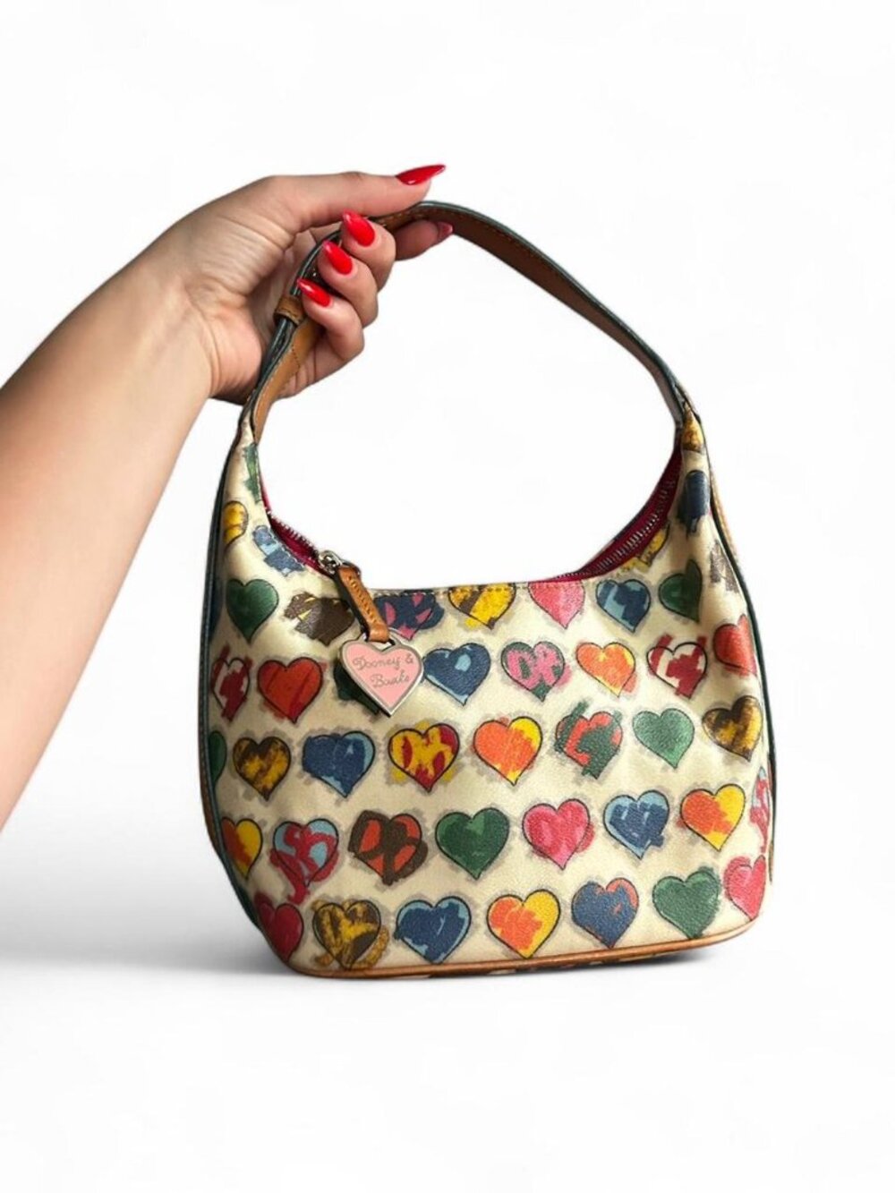 Vintage Dooney & Bourke handbag features a colorful, crayon-style heart pattern